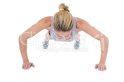 Strong woman doing press ups