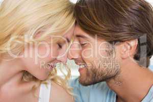 Cute couple facing each other with eyes closed