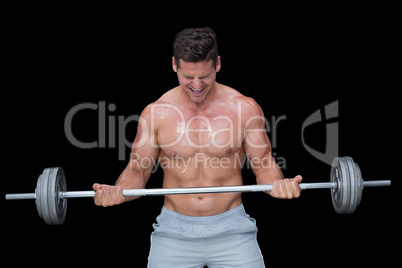 Shouting crossfitter lifting up heavy barbell