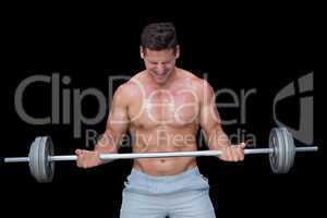 Shouting crossfitter lifting up heavy barbell