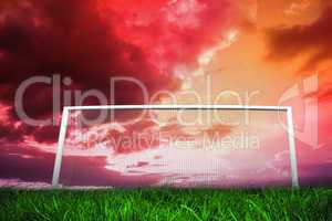 Football goal under red cloudy sky
