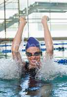 Excited swimmer cheering in the swimming pool