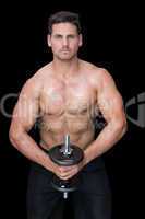 Strong crossfitter lifting up heavy black dumbbell