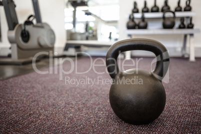 Black kettlebell on the weights room floor