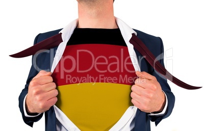 Businessman opening shirt to reveal germany flag