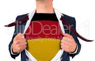 Businessman opening shirt to reveal germany flag