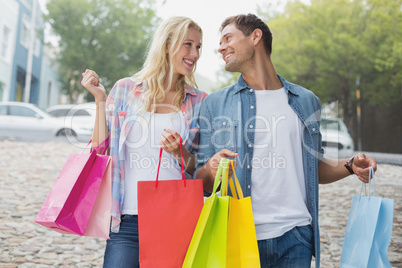Hip young couple on shopping trip