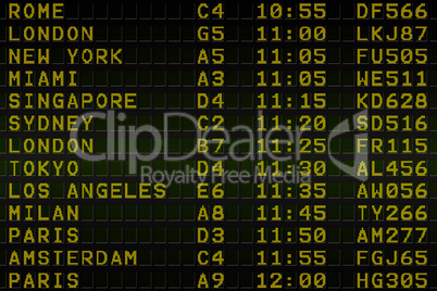 Black airport departures board with yellow text