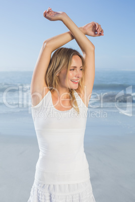 Gorgeous happy blonde posing at the beach