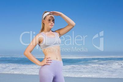 Sporty focused blonde on the beach