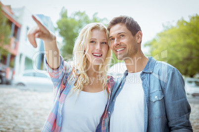 Hip young couple looking at something