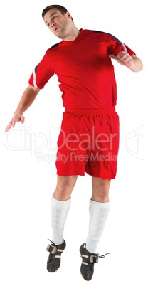 Football player in red jumping