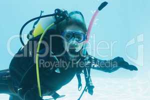 Woman on scuba training submerged in swimming pool