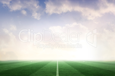 Football pitch under blue sky