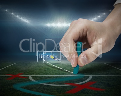 Hand drawing tactics on football pitch