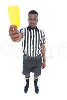 Serious referee showing yellow card