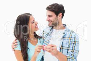 Happy young couple holding new house key