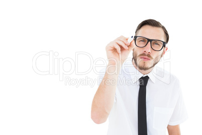 Geeky businessman writing with marker