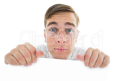 Geeky hipster smiling and showing card Geeky hipster smiling and showing card