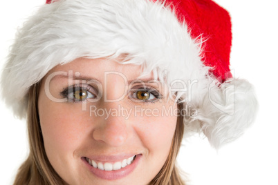 Close up portrait of pretty woman in santa hat