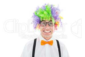 Geeky hipster wearing a rainbow wig