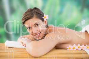 Side view of a beautiful woman on massage table