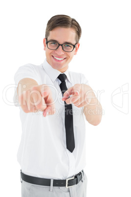 Geeky young businessman pointing at camera