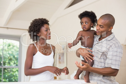 Happy parents with their baby girl