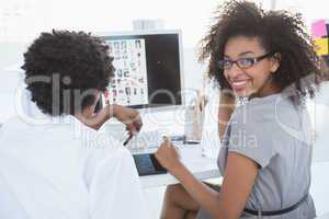 Young editorial team working together at desk