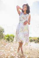 Beautiful woman in floral dress smiling