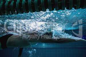 Fit swimmer training on his own