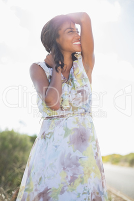 Beautiful woman in floral dress smiling