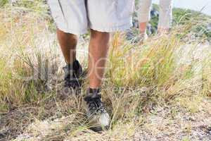 Hiking couple walking on mountain trail