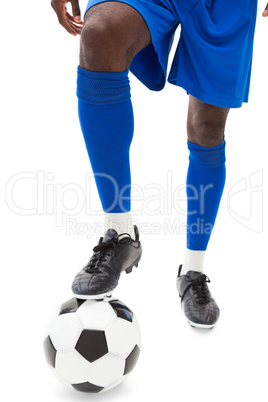 Football players legs with ball