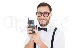 Geeky hipster holding a retro cellphone
