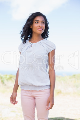 Casual pretty woman standing in the wind