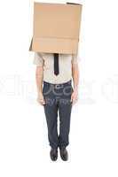 Businessman standing with box on head