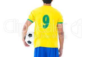 Football player in yellow holding ball