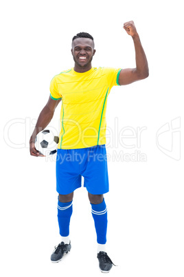 Football player in yellow celebrating a win