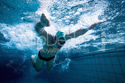 Fit swimmer training by himself