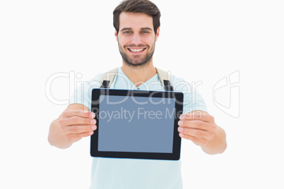 Handsome student showing his tablet pc