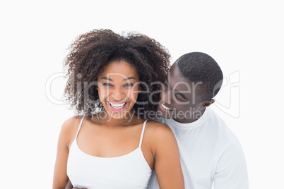 Attractive couple in matching clothes smiling at camera