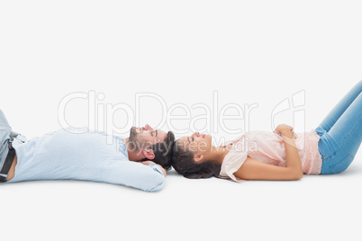 Attractive young couple lying down