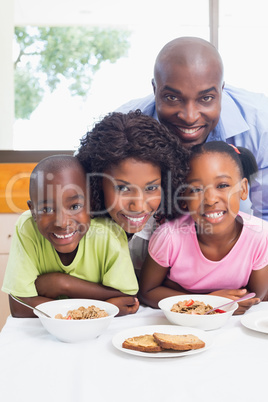 Happy family having breakfast together in the morning