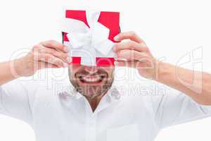 Stressed man holding a present