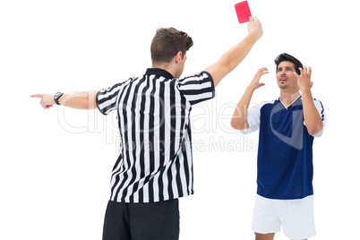 Referee sending off football player