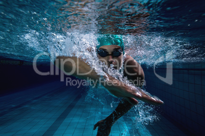 Fit swimmer training by himself