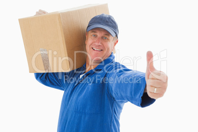 Happy delivery man holding cardboard box