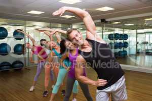 Fitness class led by handsome instructor