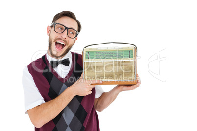 Geeky hipster holding a retro radio